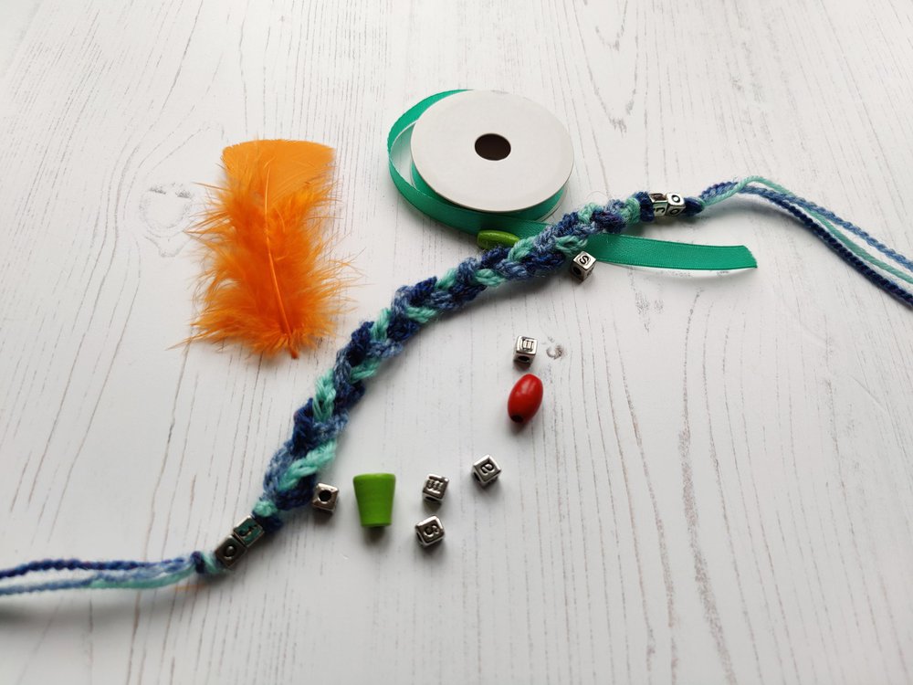 Colourful materials for a knitted bracelet