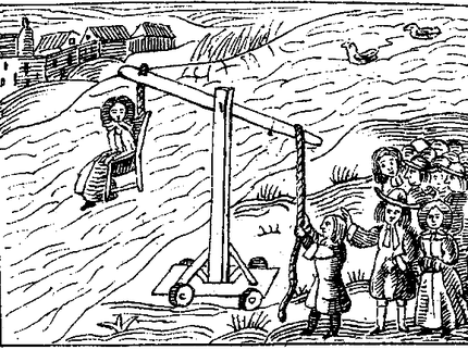 A 17th Century black and white woodcut image of a woman on a ducking stool, held over a river by a group of other people.