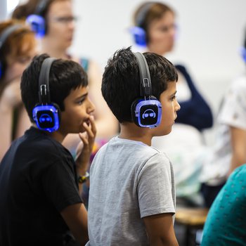 Children wearing headsets.