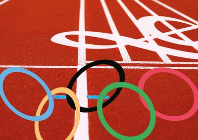 Graphic of 5 interlinked Olympic rings overlaying a 5 line stave with a treble clef