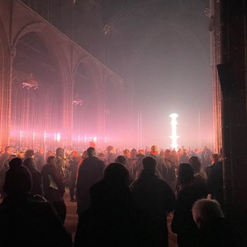 A crowd in a lit up church