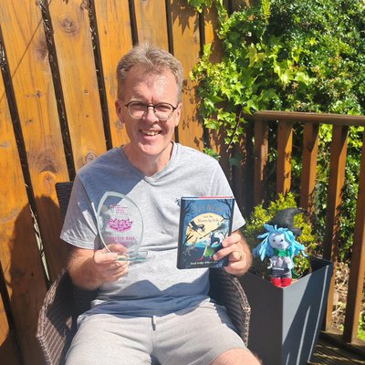Author Derek Keilty holding his Inspiread award