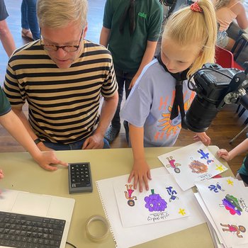 Working with a scout group to draw leaves