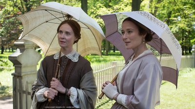 A Quiet Passion.  Two ladies standing with parasols in Victorian dress