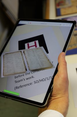 Tablet showing digital image of a historic document