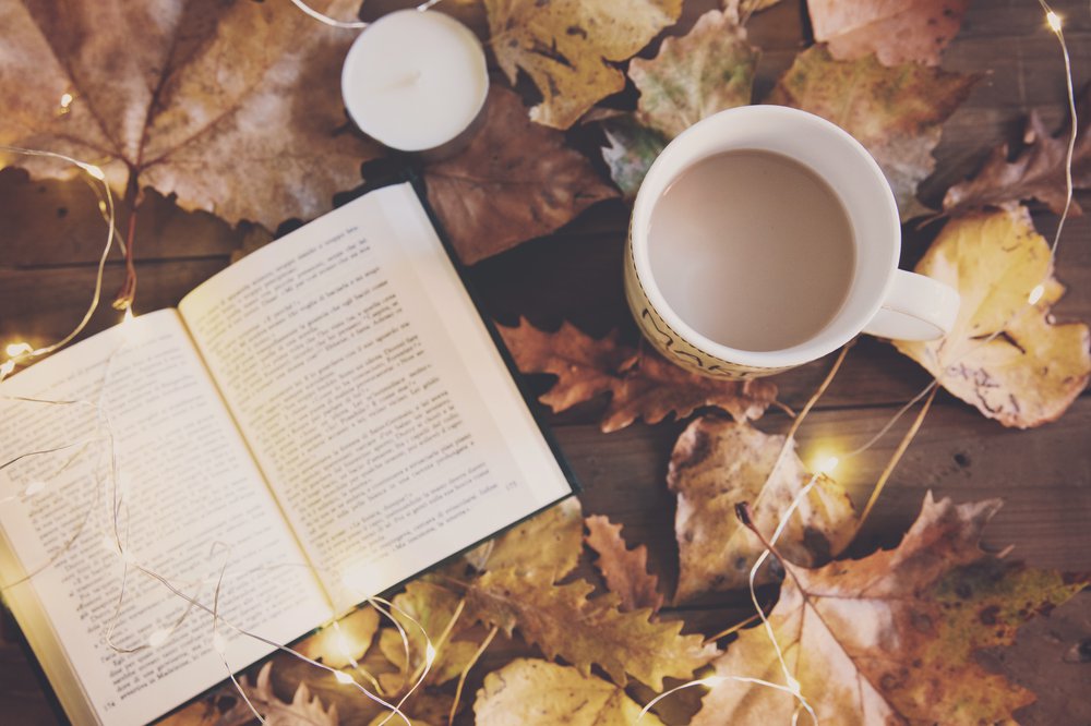 Book, coffee and leaves