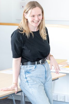 Annie Warren stood against a table talking