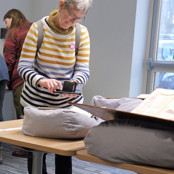 Visitor viewing augmented reality content on smartphone