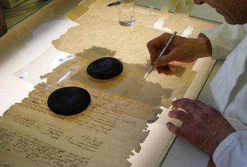 Conservation work on damaged document