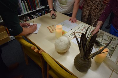 Desk with map, quill pens and candles