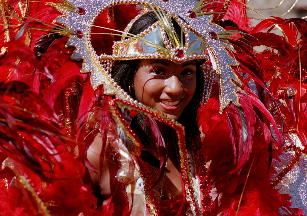 Description – Woman in a carnival costume at Notting Hill Carnival
