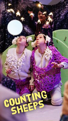 Two actors dressed like sheep looking at fireflys