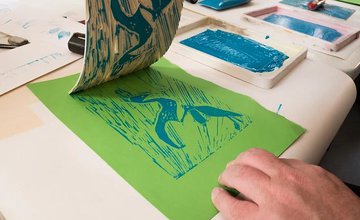 Hands showing Lino Printing