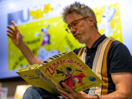 Fred Blunt reading a book