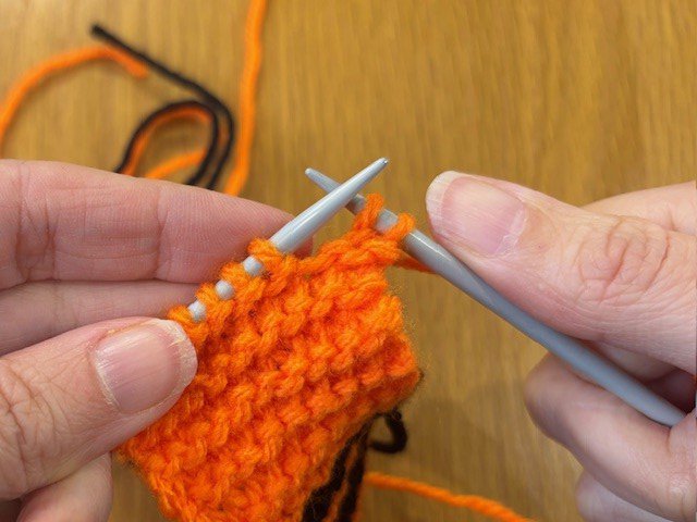 Two stitches knitted onto the left-hand needle