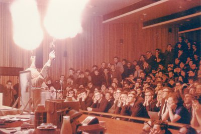 Colonel B D Shaw firing guns at one his lectures