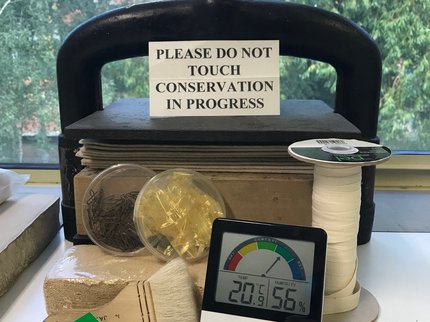 A book press with conservation equipment
