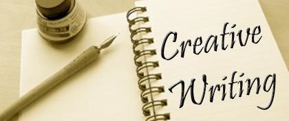 notebook open with quill and ink and text that reads creative writing