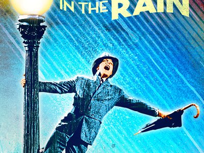 Man singing and swinging  from a lamppost in the rain.