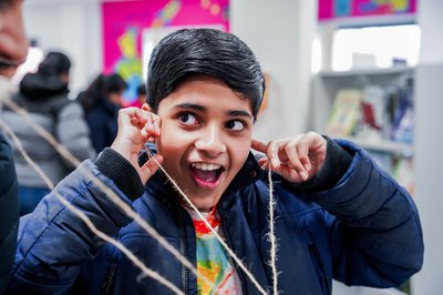 A boy experiments with sound.