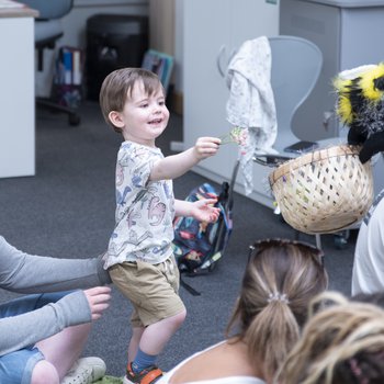 A child playing as part of a family event.