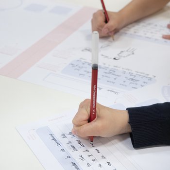 Two children writing