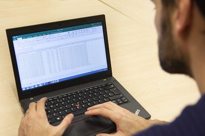 Male adult working on a laptop