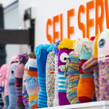 A row of knitted Worry Monsters