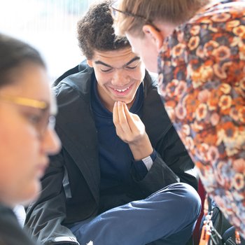 A learner looking at their results with a tutor.