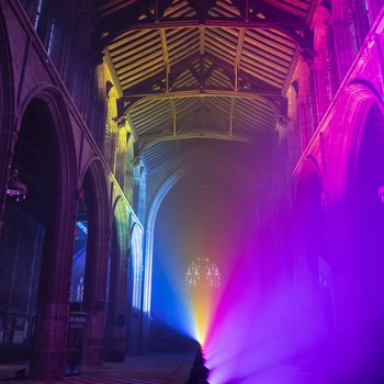 A rainbow of lights in a church interior.