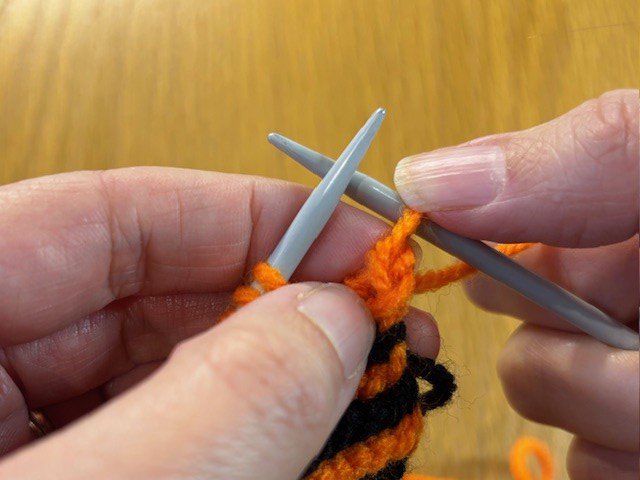 One stitch on right-hand needle
