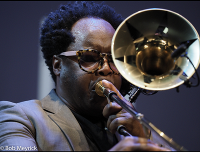 Dennis Rollins MBE playing his trombone