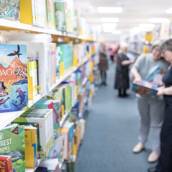 A shelf full of books with staff shelving
