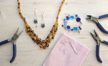 Jewellery and tools laid out on table