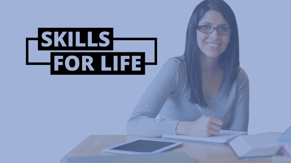 Skills for life logo. A lady sat at a desk with dark hair smiling towards you. Blue Background.