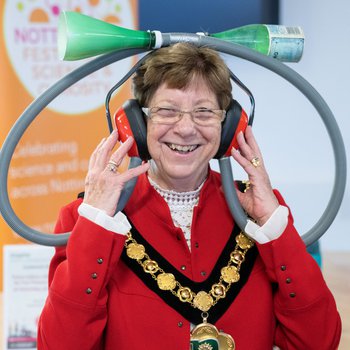NCC Councillor Jan Goold trying out science headset