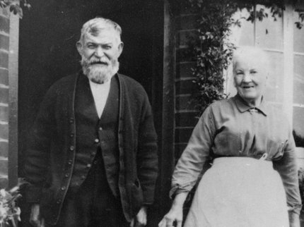 A black and white photograph of an elderly white couple