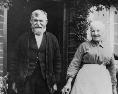 A black and white photograph of an elderly white couple