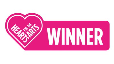Hearts for the Arts winner logo in bright pink with a heart motif