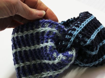 an easy to make hand knitted headband to wear on your head