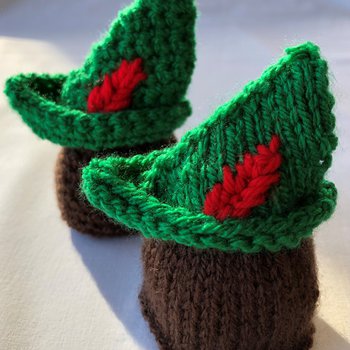 Two miniature Knitted Robin Hood hats