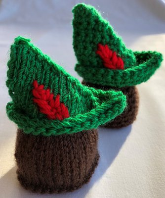 Tiny knitted and crocheted Robin Hood hats