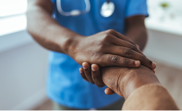 carer holding arm of resident