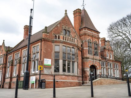 Hucknall library building which is a red brick building with a tower porch