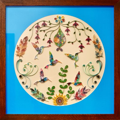 A framed piece of art made out of paper