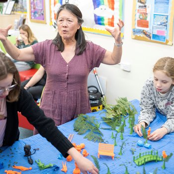 Photo of storyteller Ling Peng and two members of Spectrum WASP
