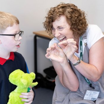 Photo of Storyteller Nicky Rafferty, working with children from Bracken Hill School