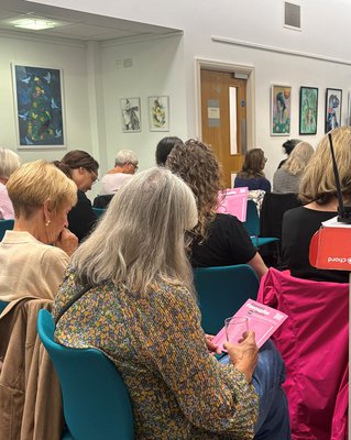 From behind, audience members looking at the Inspire's Favourite Reads shortlist