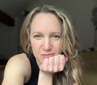 Amanda is a dark blonde woman wearing a black top