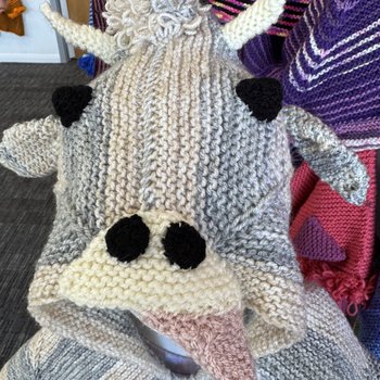 Highland cow character Story Snuggler